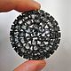 Pendant brooch round shape, in dark shades of gray natural spinel.
