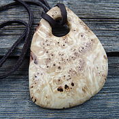 The pendant is made of bog oak
