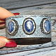 Leather bracelet reptile on a metal basis is decorated with natural kyanite surrounded by crystals rhinestone and marcasite
