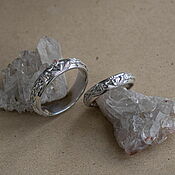 A silver ring with angels and moonstone 