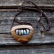 The pendant is made of birch burl