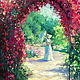 The garden through the arch with roses.
