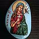 A Hand painted icon of Saint Irene (st. Irini) on a natural stone from the Black Sea shore. The icon is painted with tempera paints and is fixed with polish.