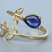 Золотое кольцо с гранатом огранки "бриолет" и бриллиантами