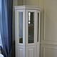 Corner Cabinet-cupboard. Has six sections with shelves for storage. Shelves behind glass doors glass handling euroedge.
