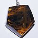 Large amber pendant with inclusions