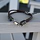 Order Braided leather bracelet with a Feather pendant. kot-bayun. Livemaster. . Braided bracelet Фото №3