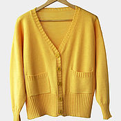 The cardigan is knitted of Alpaca wool