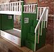 Children bunk bed with staircase, decorative Windows. The storage system is represented by two spacious drawers and small niches, arranged in stairs