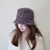 Knitted hat with an elongated top