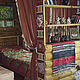  стеллаж, разделяющий комнату на две зоны, украшен оригинальным саше с кармашками для мелочей.