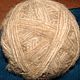 the ball of yarn from the fur of the Akita inu
