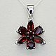 Silver pendant with natural garnets