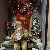 Christmas decorations: Boy on a sled with a postcard