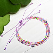 Украшения handmade. Livemaster - original item A set of bracelets made of multicolored beads on a lavender thread. Handmade.