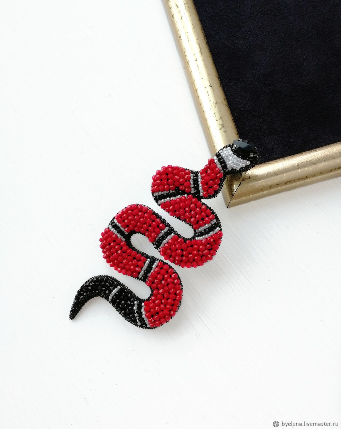 Gucci snake brooch. Red brooch on your 