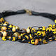 Yellow, brown and bronze beads on black waxed cord with a large clasp-toggle - versatile piece for every day, a small bar, giving a finish to the image.