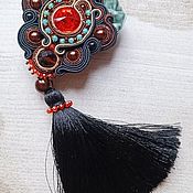 Brooch of soutache with mother of pearl