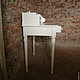 Elegant white drawer on turned legs. Made of natural wood. Hand-carved in the shape of a medallion in the center and delicate patterns on the legs gives the Secretary the individuality and nobility. S