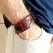 Украшения handmade. Livemaster - original item Leather bracelet with embossed and woven 