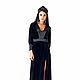 Long dress made of velvet in black color with satin edging and cuffs. The cut on his leg.
