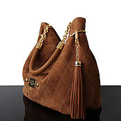 Beige quilted suede handbag on the clasp