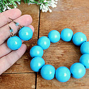 Earrings with blue wooden beads