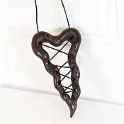 Pendant-amulet made of wood 