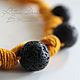 a small light necklace with a large porous black lava beads on a linen thread-mustard color - bright and stylish decoration for the summer.
