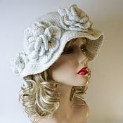 White tweed hat with a flower on top