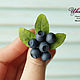 Ring with berries and leaves of bilberry
