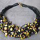 Yellow, brown and bronze beads on black waxed cord with a large clasp-toggle - versatile piece for every day, a small bar, giving a finish to the image.
